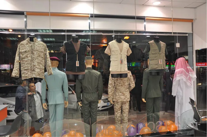 Uniforms displayed on mannequins in a TSC showroom